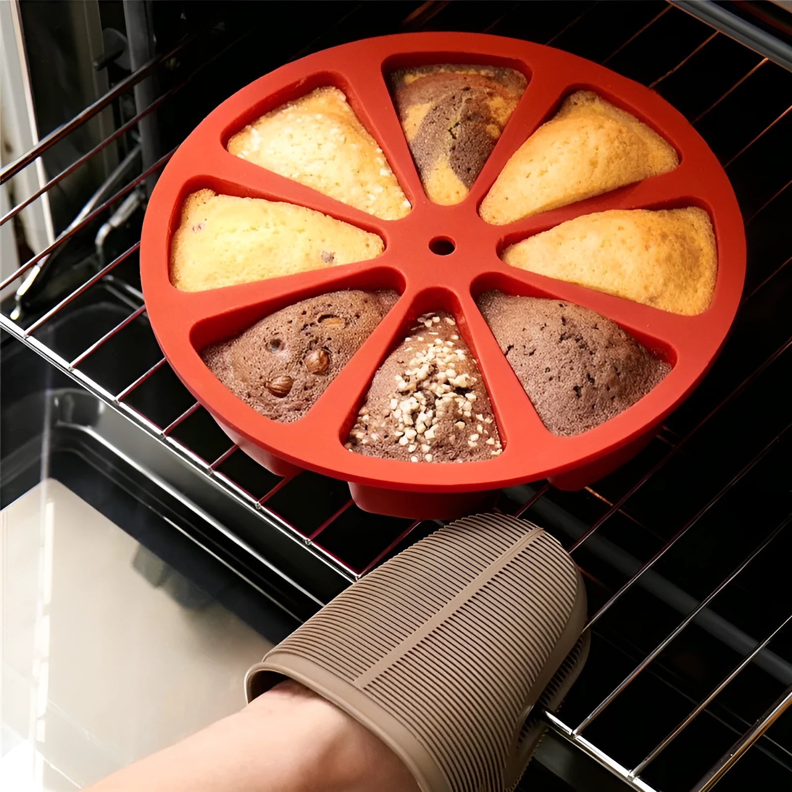 Green silicone cake mould measuring 7 by 4.5 centimetres on a baking tray.