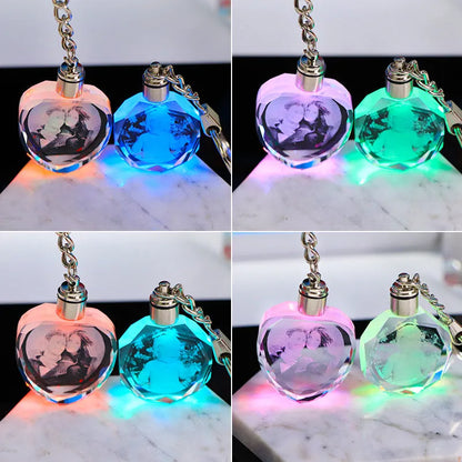 Custom laser-etched crystal photo keychain with internal colourful LED light activated, showing a personalised image.