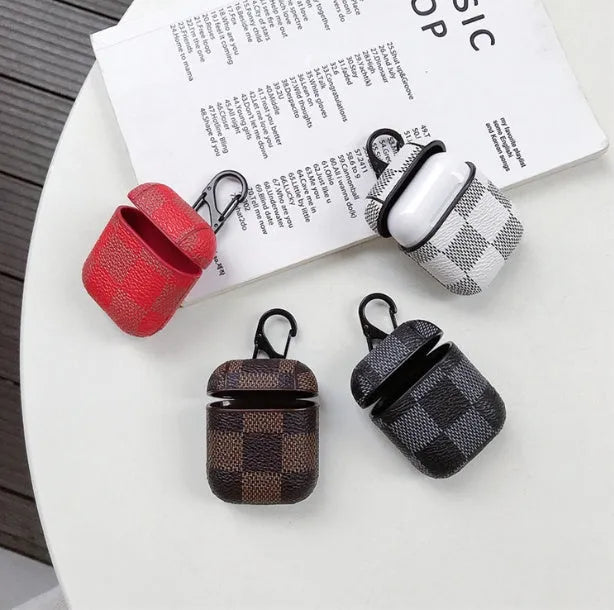 iPhone XS Max protective case in a hard shell grid design with anti-lost hook, a leather-style textured finish, and compatibility with wireless Bluetooth headset jacket attachments - available in black, brown, red, and white grid colour options
