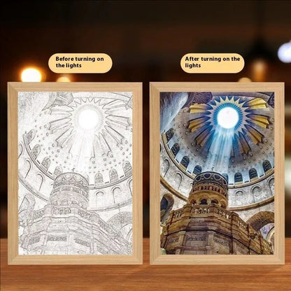 Modern rectangular light painting photo frame displaying an illuminated cross and scenic artwork.
