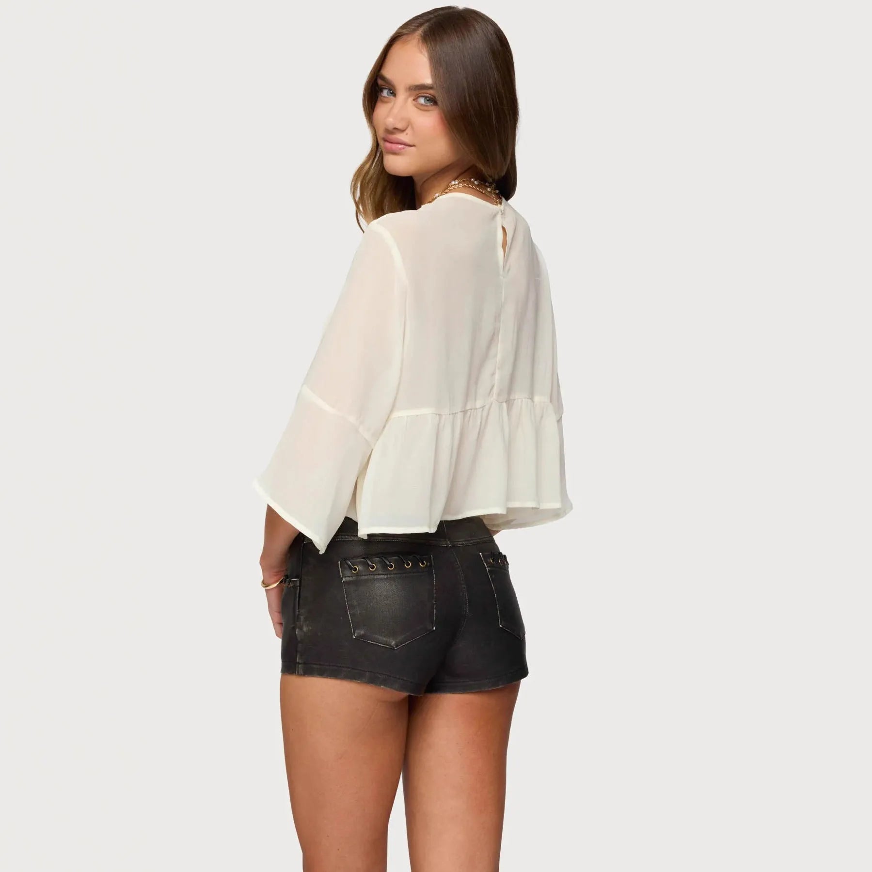 Creamy white chiffon t-shirt with batwing long sleeves on woman