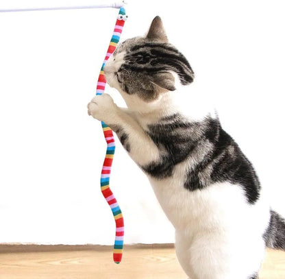 Interactive cat wand toy with a polycarbonate handle and a long green plush strip with a bell.