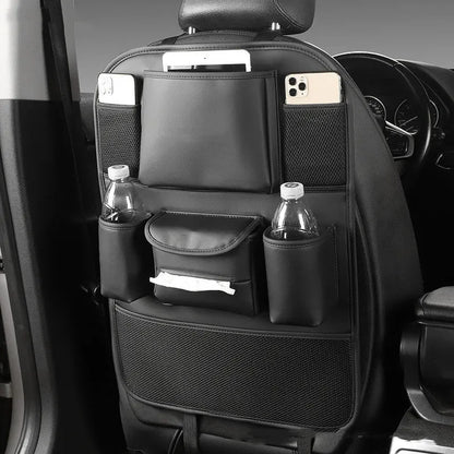 Genuine leather car seat back storage bag hanging from a headrest, shown in brown colour.