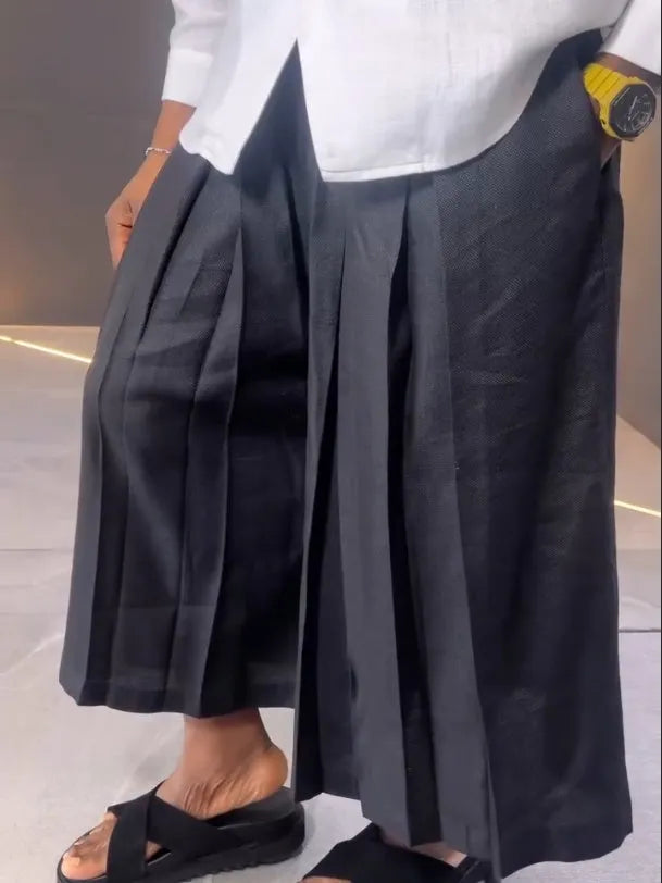 White asymmetric long-sleeve shirt and black pleated trousers casual polyester set.