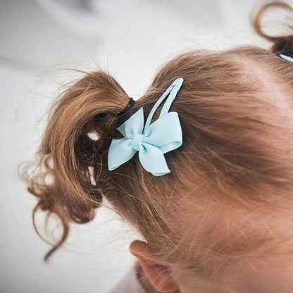 40 assorted colour snap hair bow clips with grosgrain ribbon bows measuring 2 inches wide
