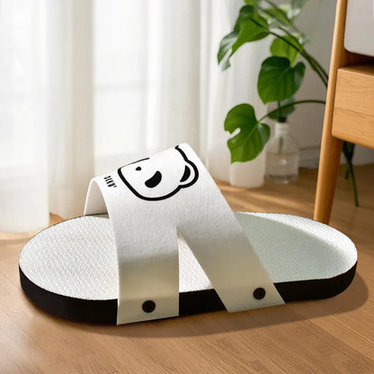 White slipper-style corrugated paper cat scratch board on a floor