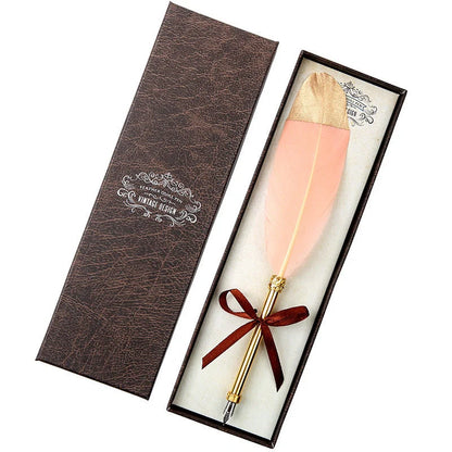 Elegant retro feather pen in a luxury gift box, featuring a sleek stainless steel casing and a stunning array of authentic feather designs.