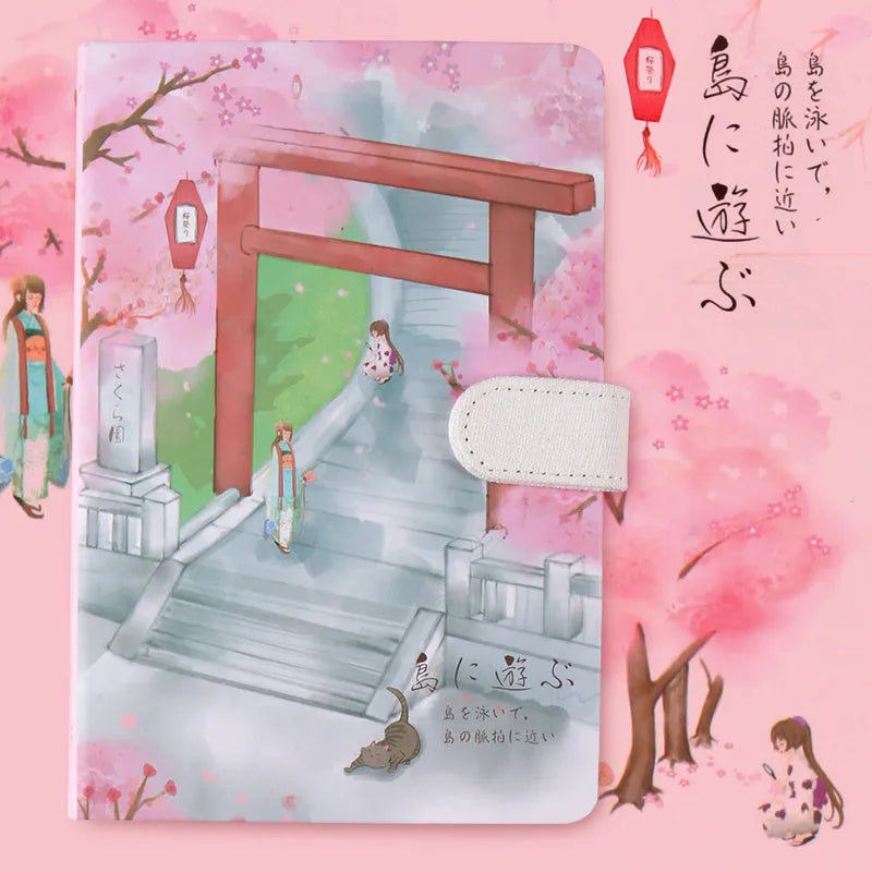 A5 wire-bound retro style notebook with colourful illustrated cover, shown with included pen.