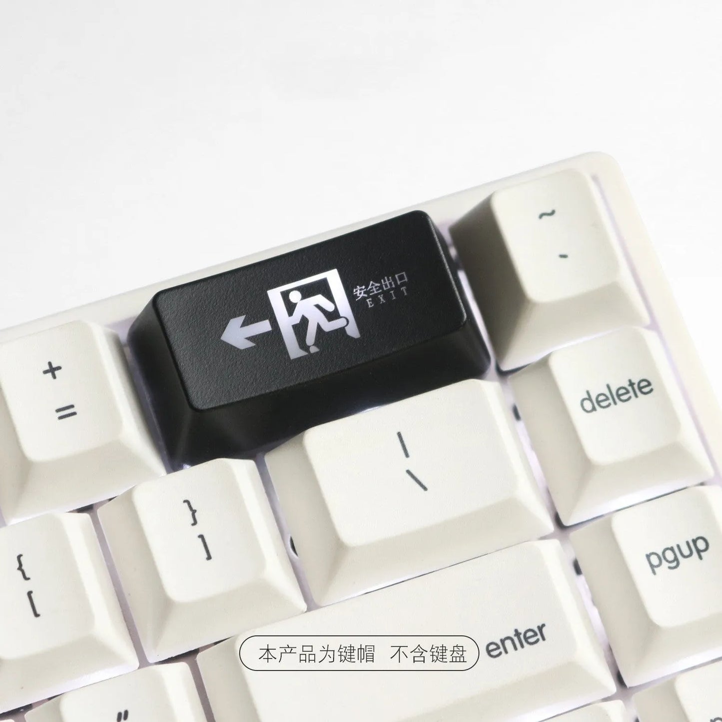 Transparent keyboard key cap with safety evacuation exit symbol design