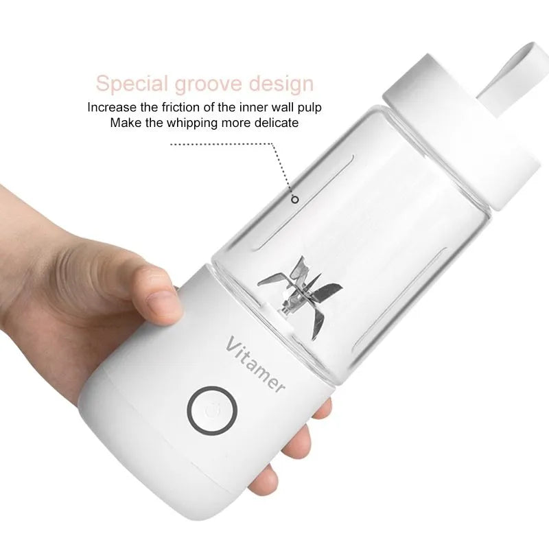 White portable USB rechargeable blender bottle with silicone handle on a Tritan cup.