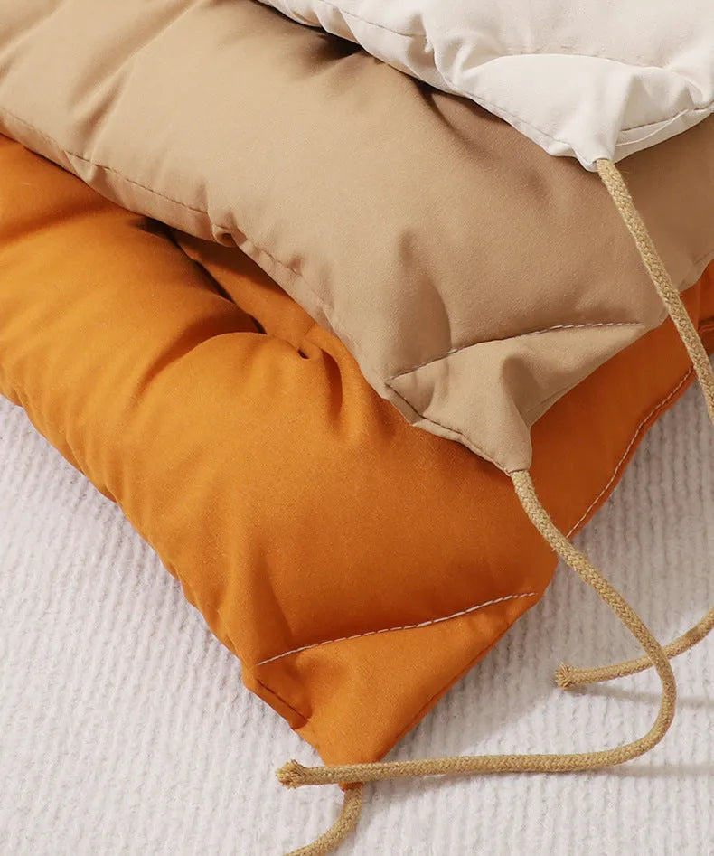 Beige cage cushion for dogs tied inside a metal crate, shown next to coffee and orange colour options.