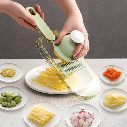Shredded vegetable slicer with stainless steel blades on green cutting board