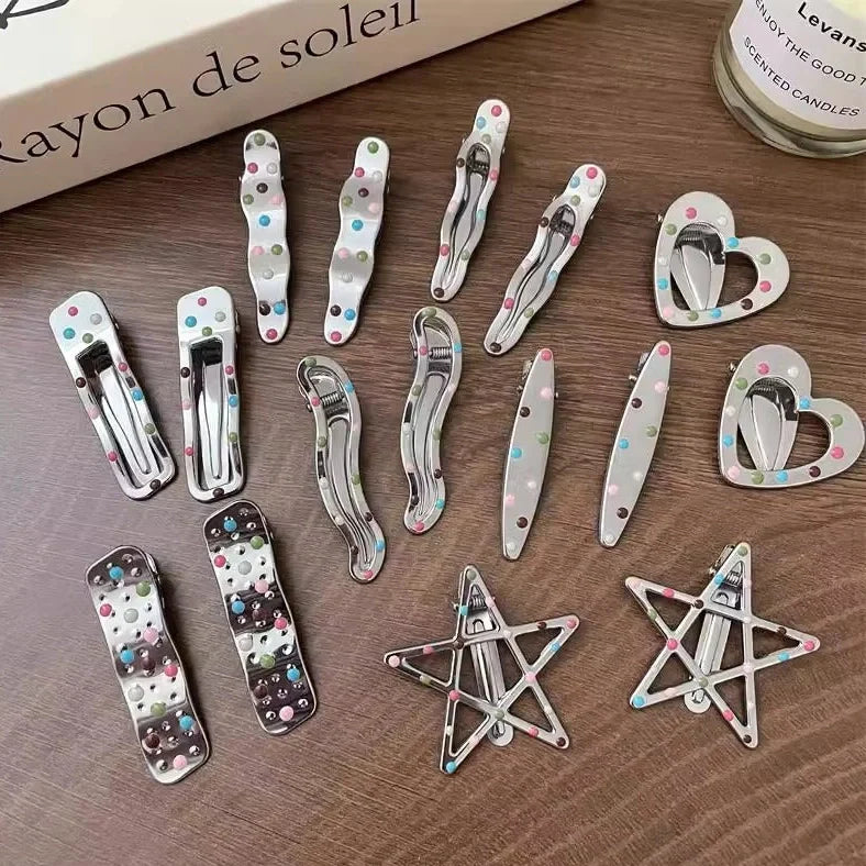Silver metal hair barrettes with hollow heart pattern and duckbill clip design