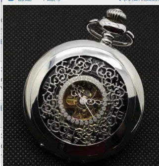 Retro mechanical pocket watch with floral print dial and transparent case back showing movement