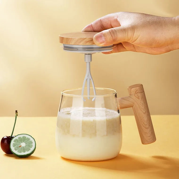 Clear borosilicate glass electric self-stirring coffee mug with 400ml capacity.