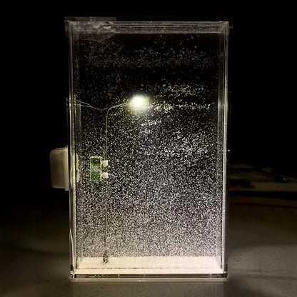 Enchanting DIY snowy night light with warm LED lighting, creating a cozy winter wonderland atmosphere