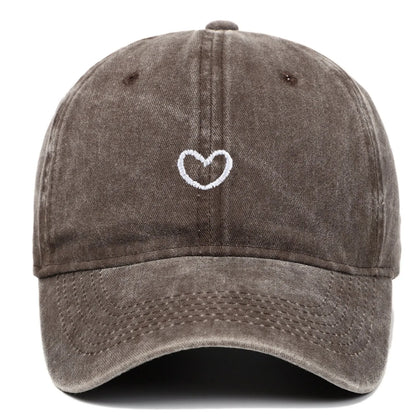 Retro-style baseball cap with colourful machine embroidery on a soft cotton dome crown, shown in a wine red colour.