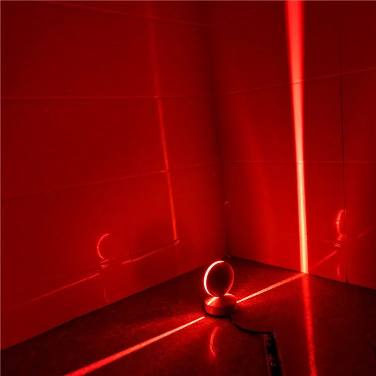 Aluminium LED spotlight bar wall lamp with glass lens, shown in a corridor setting.