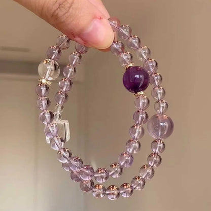 Women's artificial amethyst bracelet with U-shape design showing square stones, round stones, pearl and four-leaf clover charms