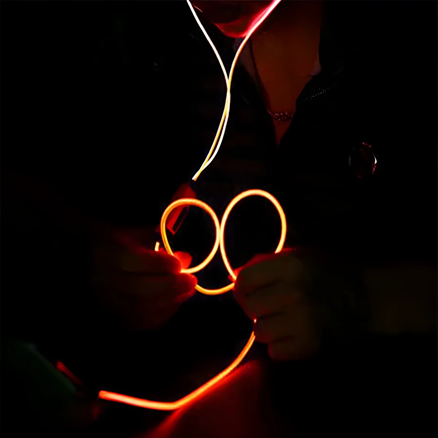 Magic Light LED Earphones in blue, green, or pink with aluminium alloy shells and EL light lines syncing to music rhythm.