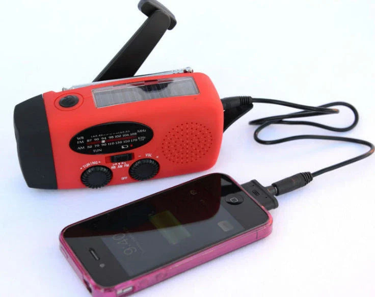 Portable solar and hand-cranked USB charging radio flashlight with LED illumination for outdoor adventures and emergency preparedness
