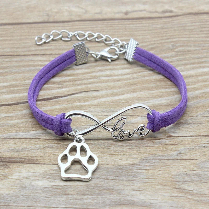Stylish hand-woven infinite love pet bracelet in various colours, featuring a bow design and made of premium alloy materials