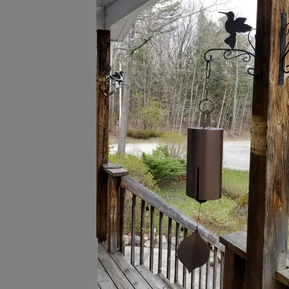 Elegant iron wind chimes in black and brown colors, designed for decorative garden and outdoor use
