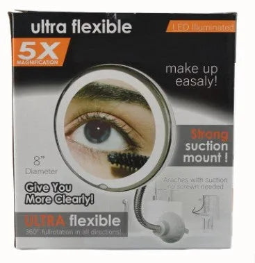 White 10x magnifying LED makeup mirror with flexible gooseneck and suction cup base on a table.