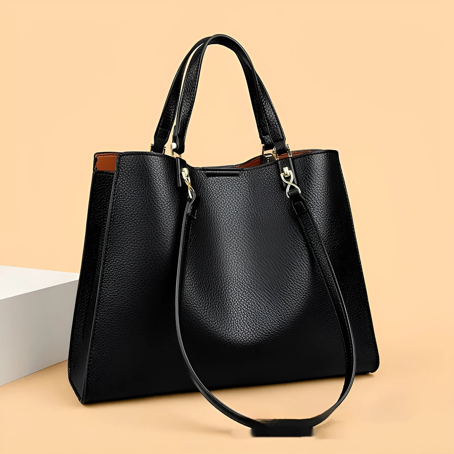 Women's messenger tote bag in horizontal square shape with crossbody strap and internal compartments