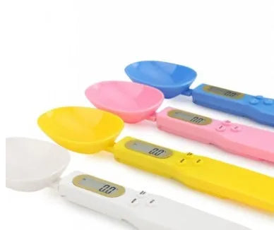 White digital spoon kitchen scale with LCD display showing weight measurement