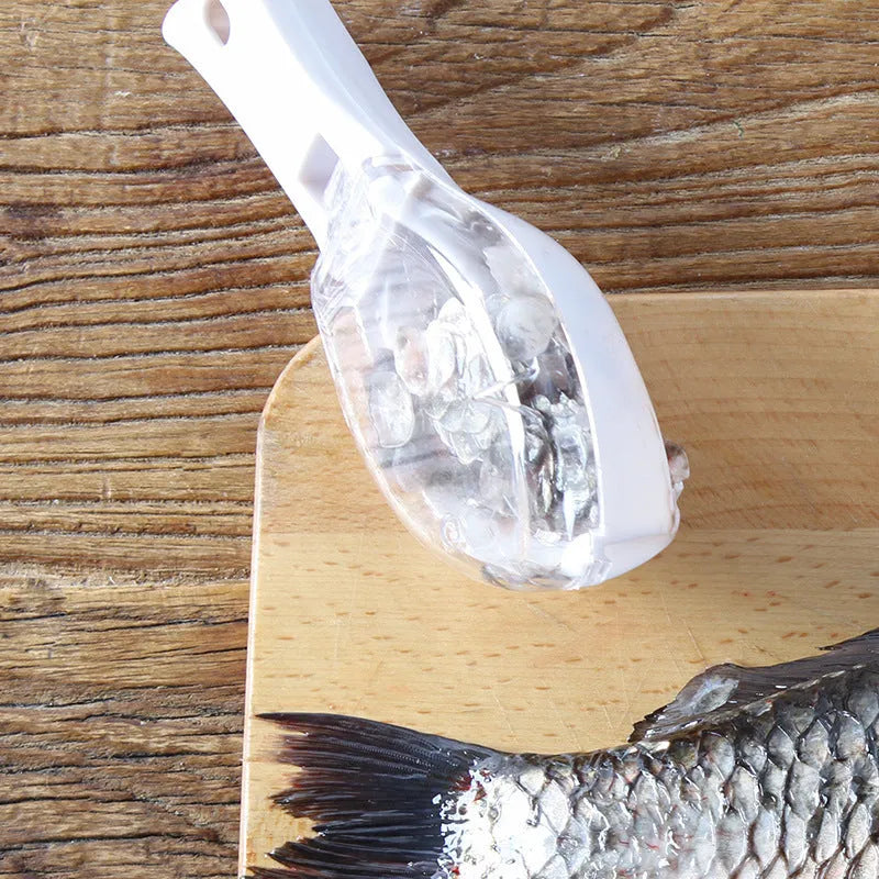Fish-shaped scaler tool with cover to prevent scale splashing during fish cleaning