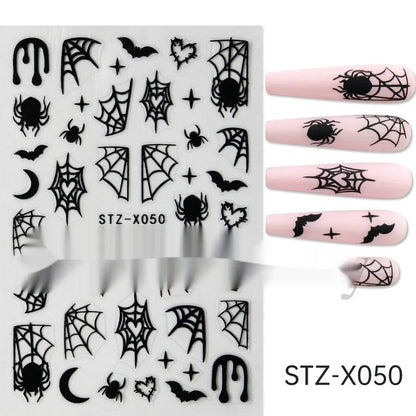 Assortment of black and silver nail sticker designs including cartoon and French tip patterns on a plastic sheet.