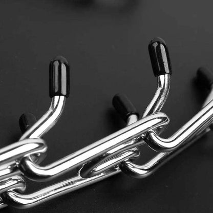 Stainless steel dog training collar with adjustable prong links and rubber comfort tips for medium to large dogs
