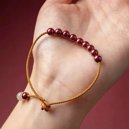 Hand-woven cinnabar bracelet with Hetian jade accents and simple geometric design