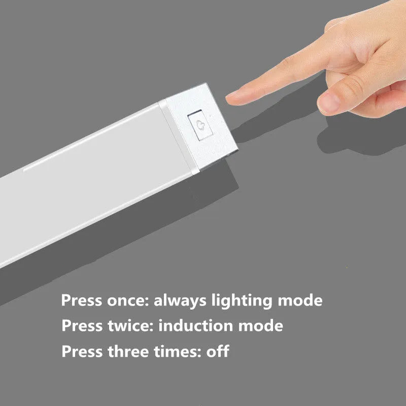 A matte aluminium LED closet light with a magnetic back, shown mounted inside a wooden wardrobe.