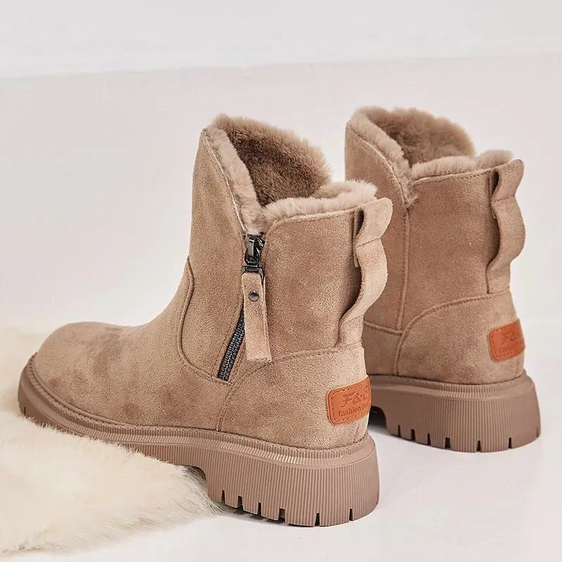 Women's black faux suede high-top snow boots with a side zipper and fur-lined collar.