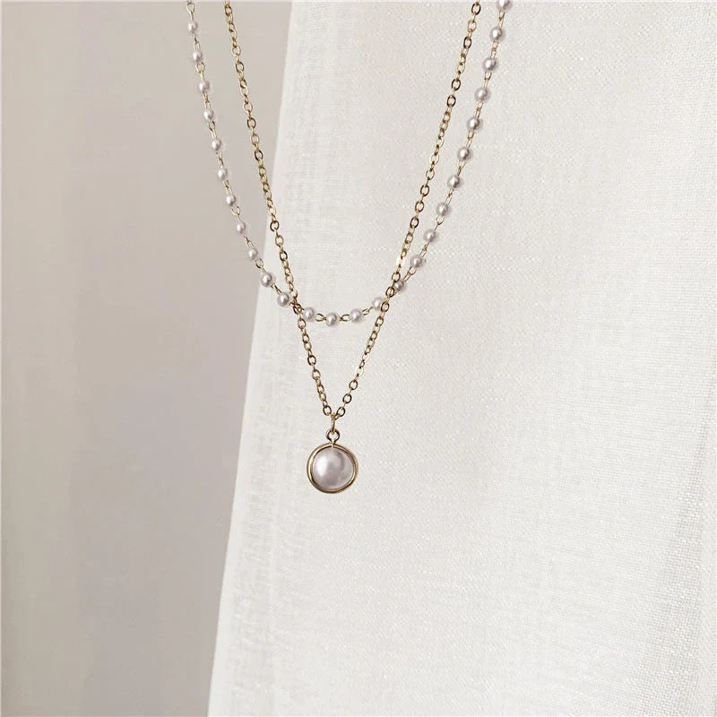 Elegant double-layer pearl necklace for women in gold, showcasing sophisticated design and high-quality craftsmanship.