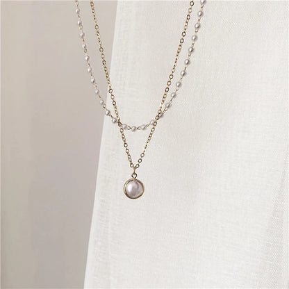 Elegant double-layer pearl necklace for women in gold, showcasing sophisticated design and high-quality craftsmanship.