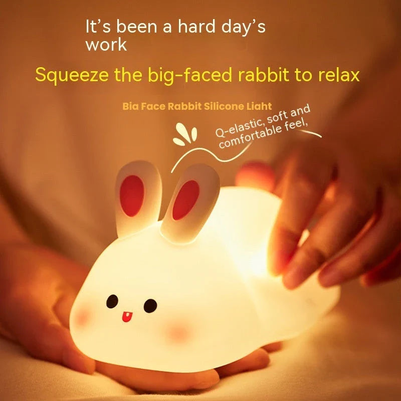 Adorable LED night light with soft silicone design and rabbit face, perfect for kids' bedrooms
