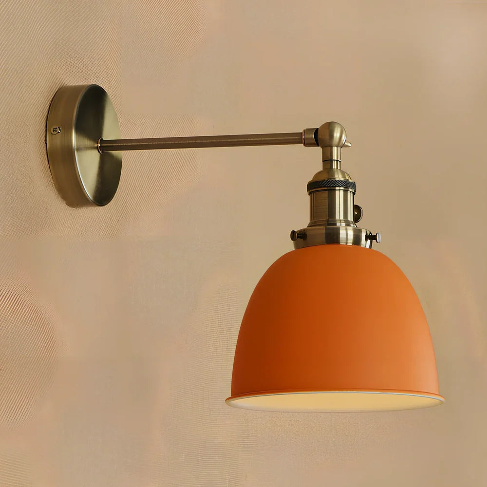 Bedroom wall light with 15cm wide iron shade in pink colour, mounted 20cm projection for soft illumination