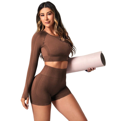 Women's high waist yoga suit in black colour showing long sleeve top and matching leggings