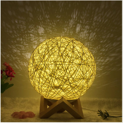 LED rattan table lamp with hand-knit linen shade in various colours