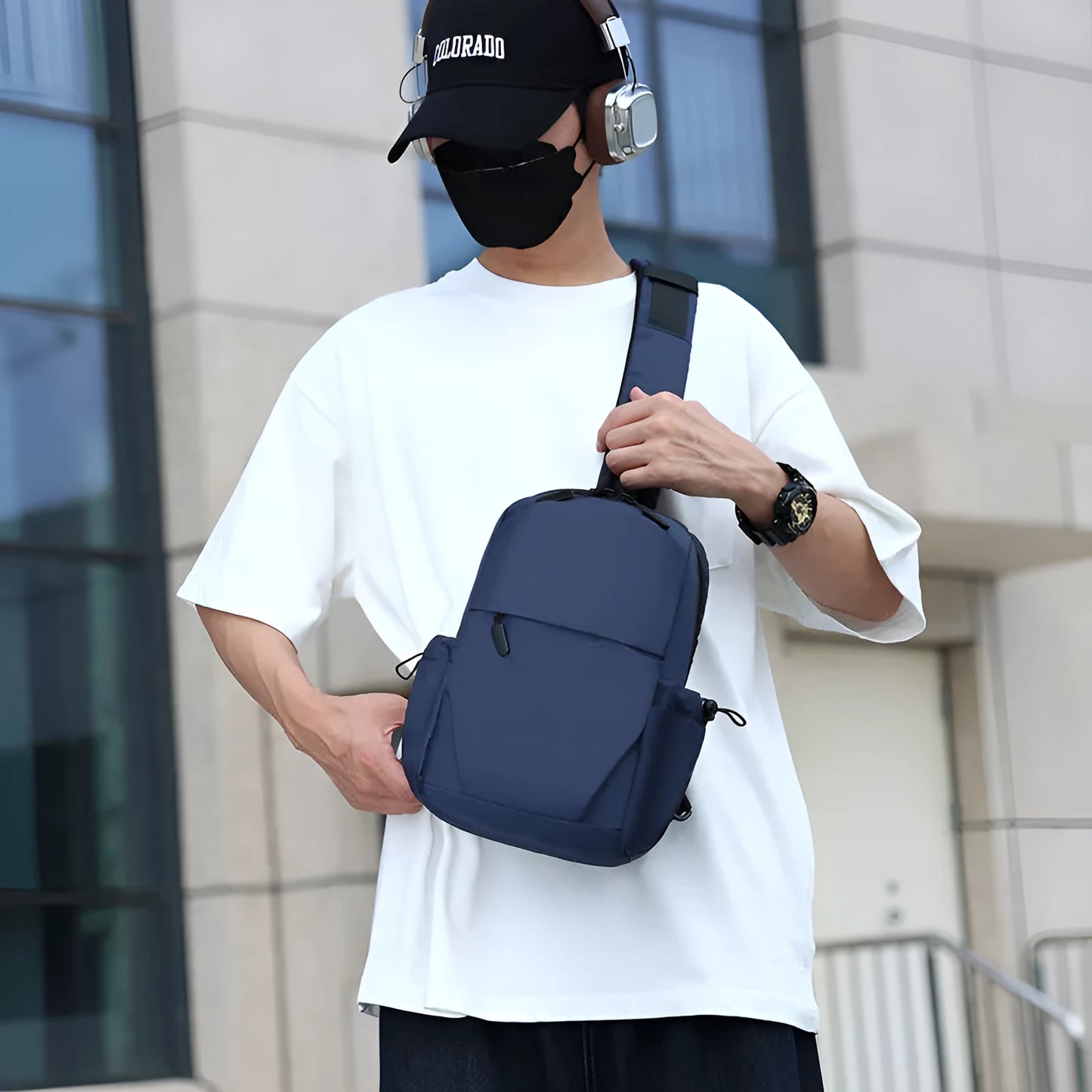 Men's waterproof messenger bag in grey showing front pocket and adjustable shoulder strap