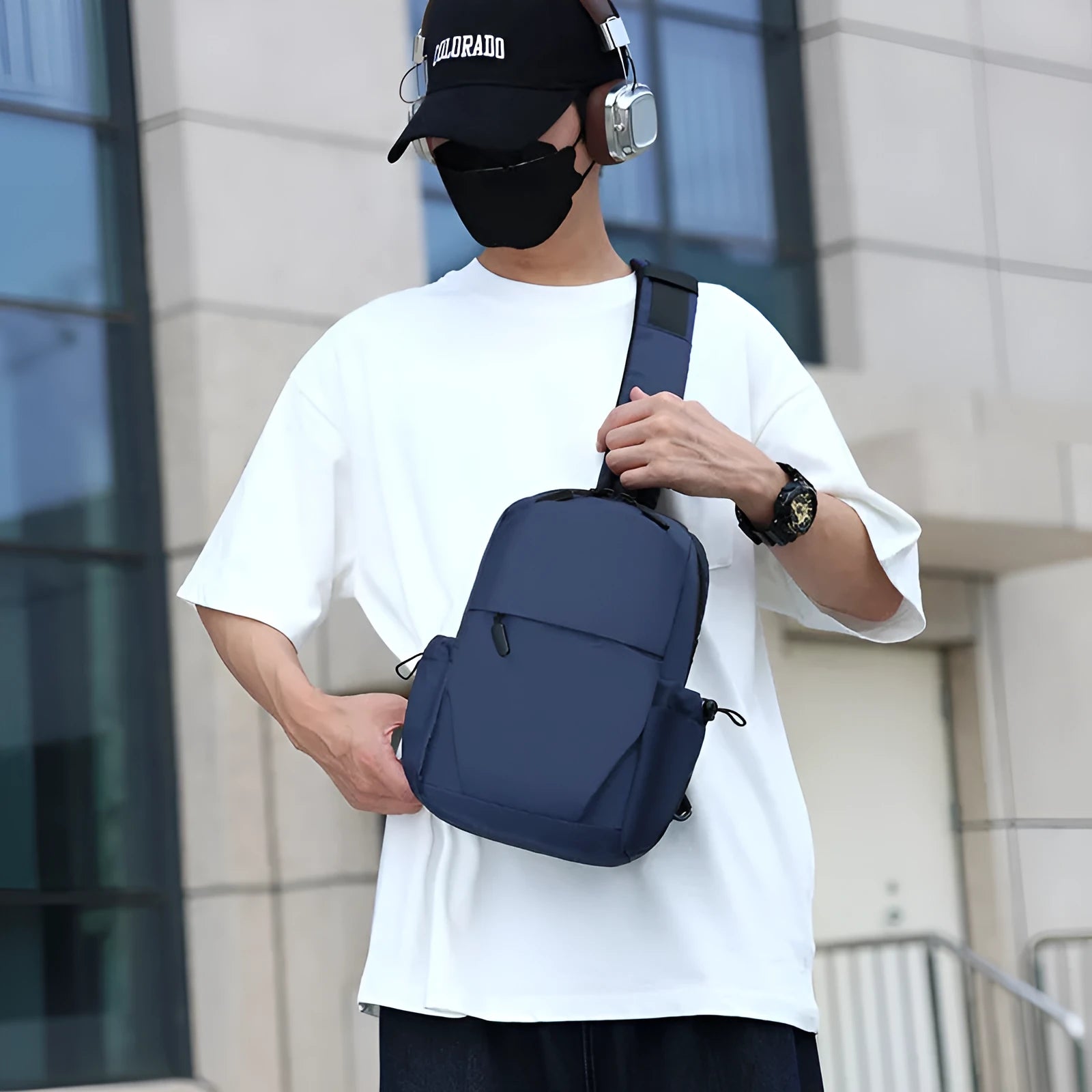 Men's waterproof messenger bag in grey showing front pocket and adjustable shoulder strap