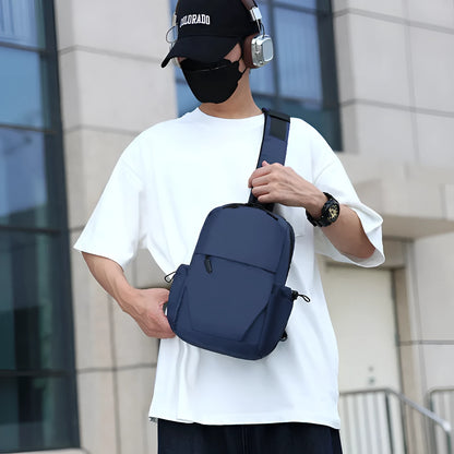 Men's waterproof messenger bag in grey showing front pocket and adjustable shoulder strap