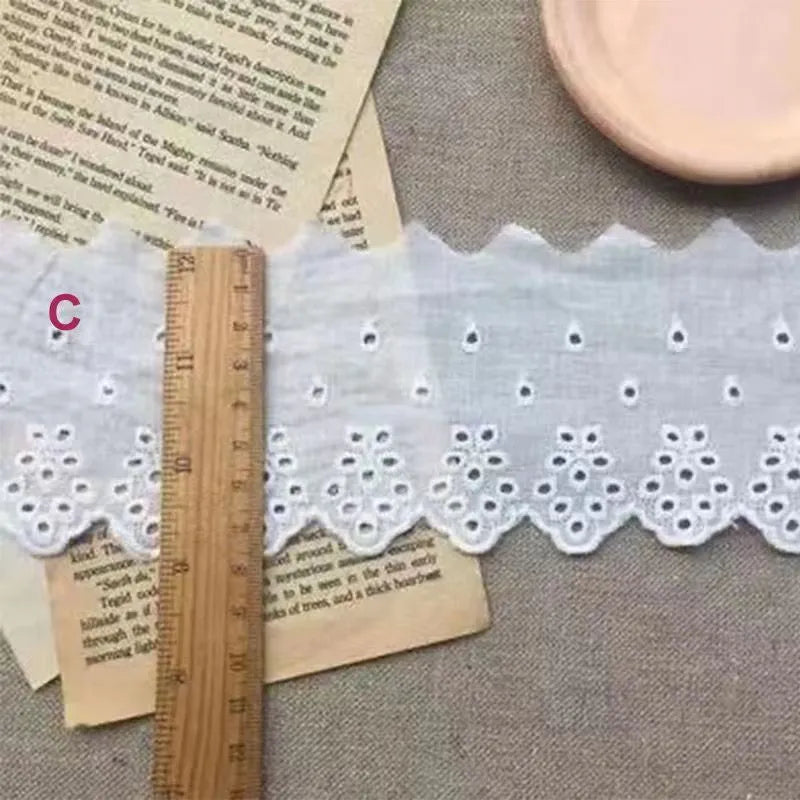 Cotton embroidered lace trim ribbon showing floral cutout patterns in four different width styles