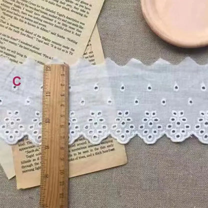 Cotton embroidered lace trim ribbon showing floral cutout patterns in four different width styles