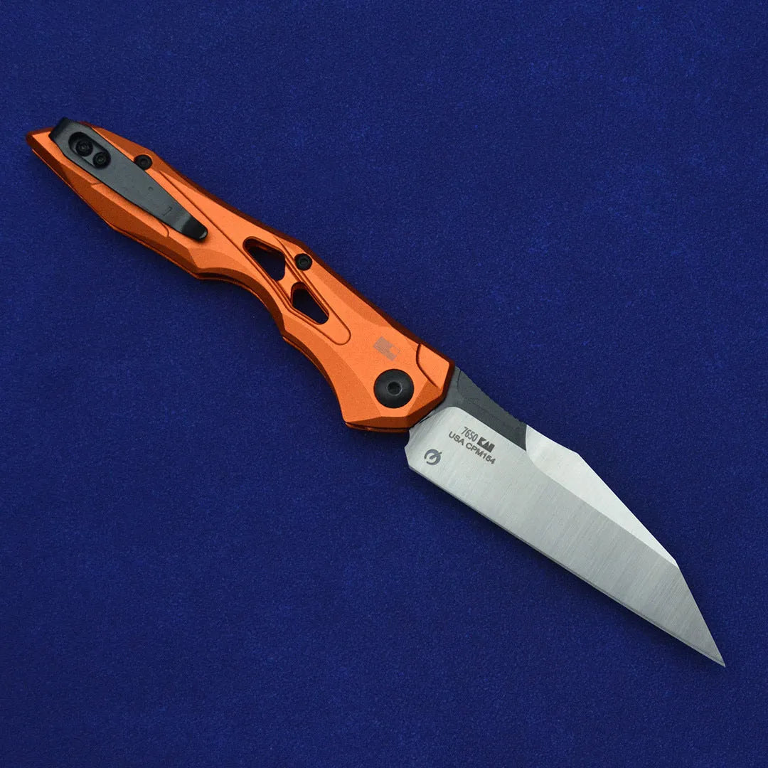 Black folding fruit knife with D2 steel blade and aluminium handle, shown open with length scale.