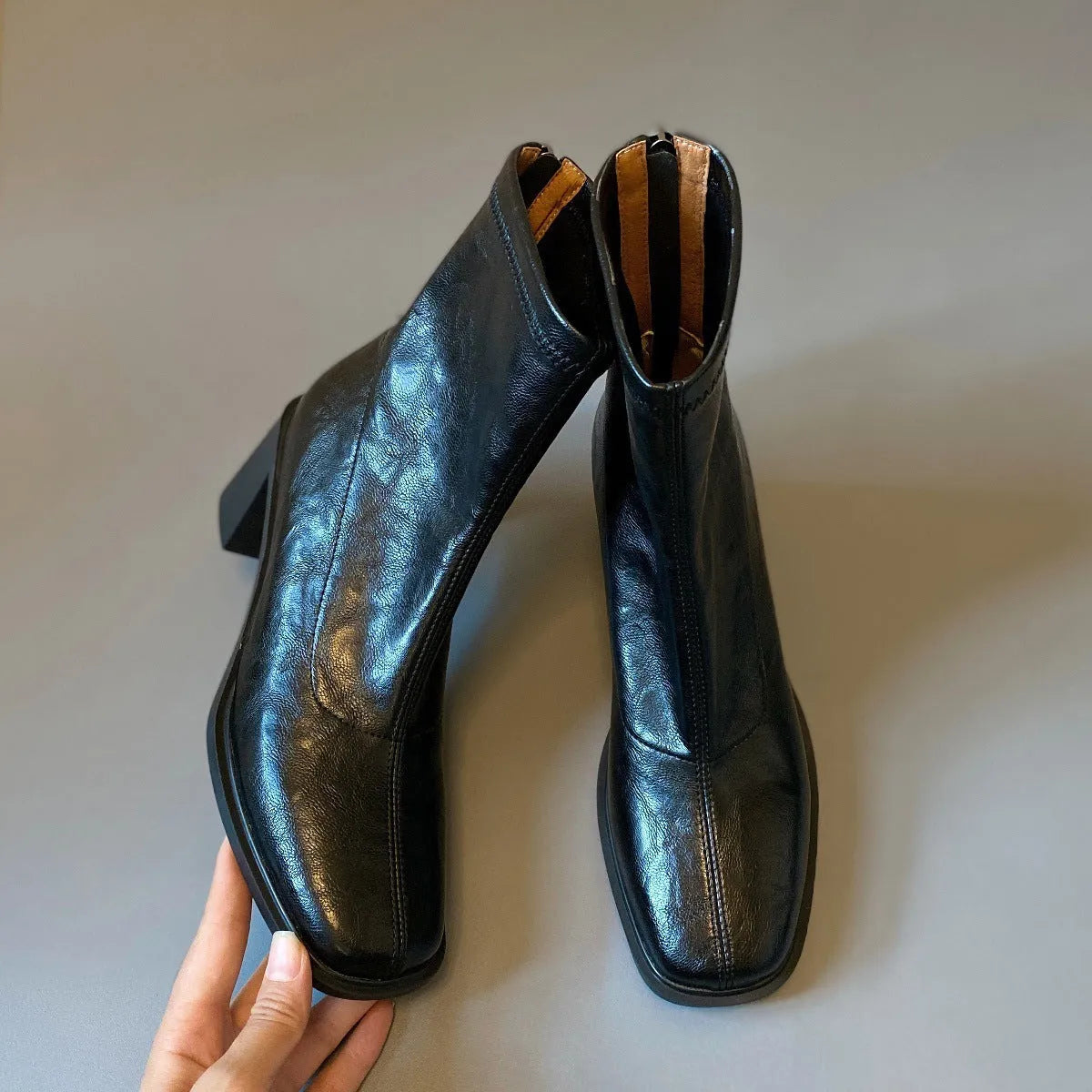 Women's retro ankle boots with chunky mid heel, square toe, back zipper, black microfibre upper, rubber sole.