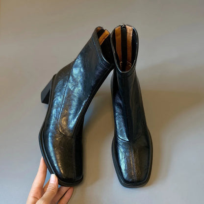 Women's retro ankle boots with chunky mid heel, square toe, back zipper, black microfibre upper, rubber sole.